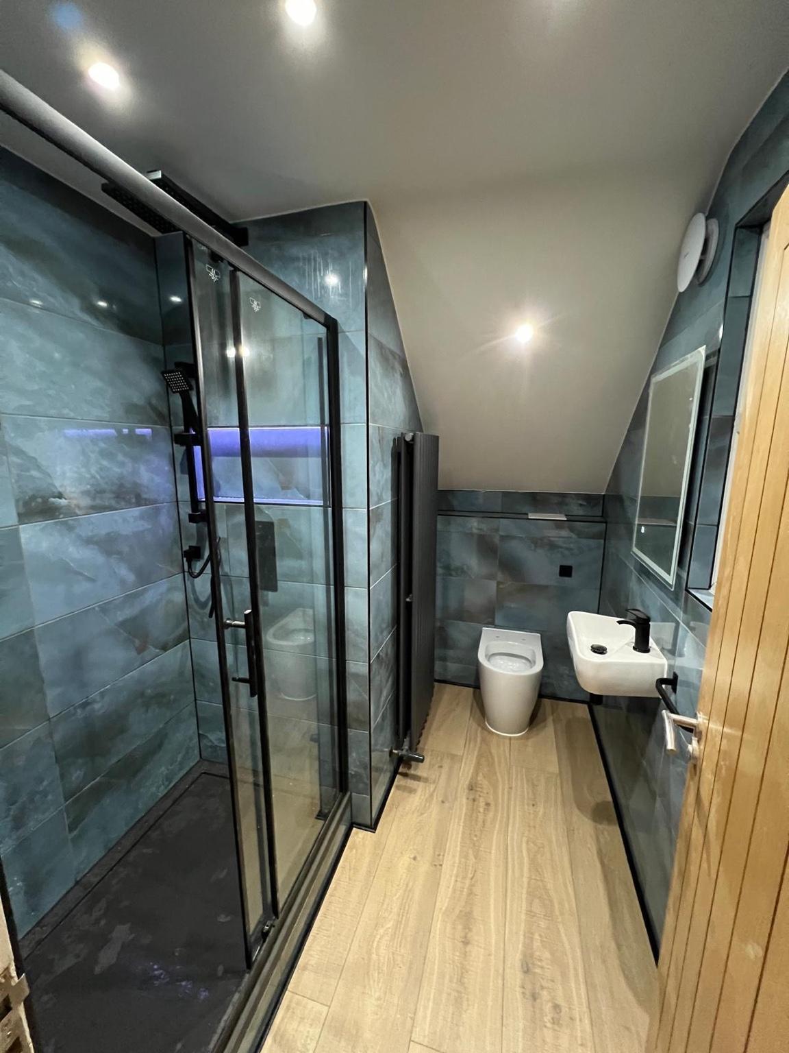 Blue stone shower room — completed bathroom