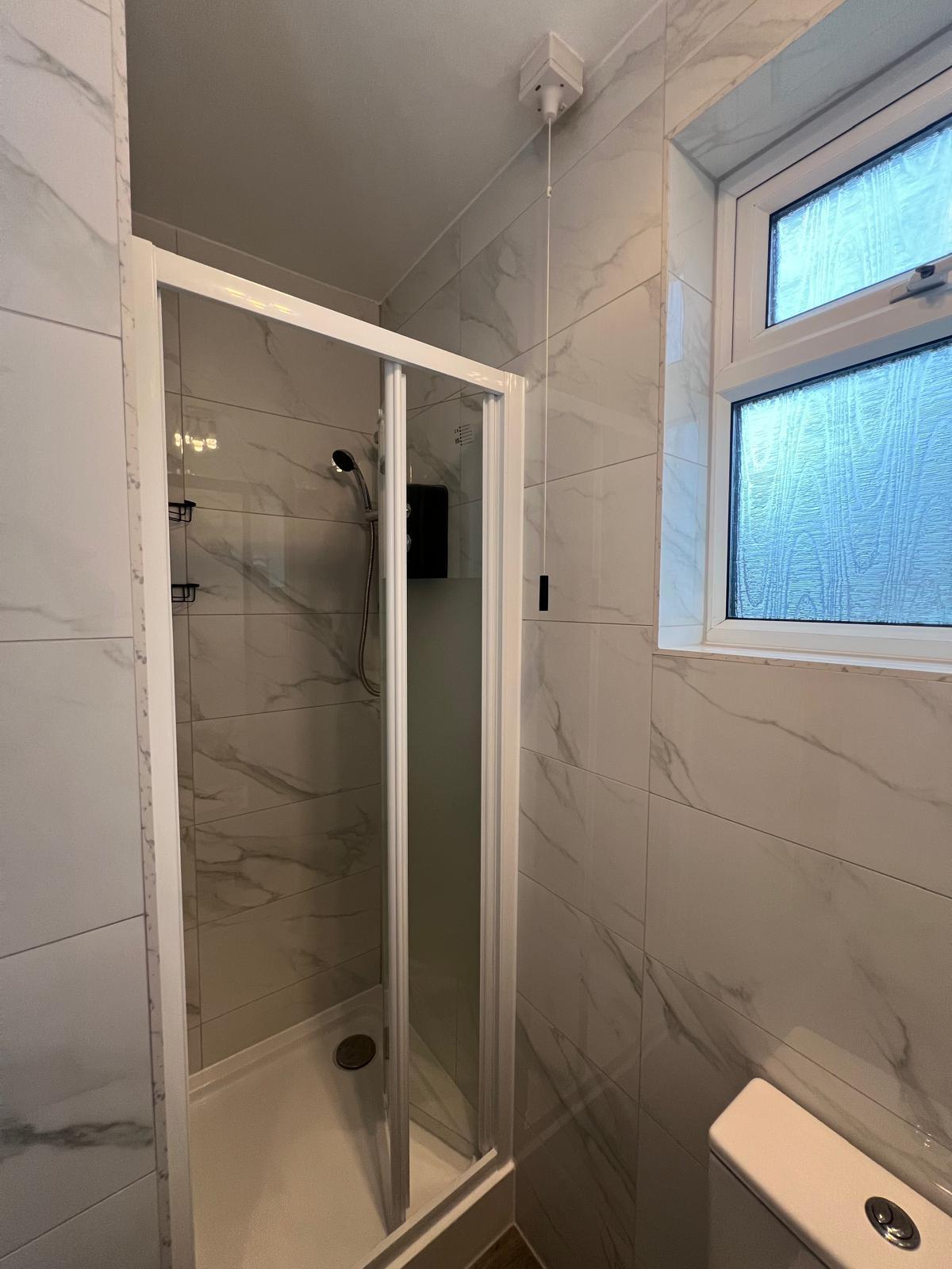 Compact Marble-Effect Shower Room Transformation — completed bathroom