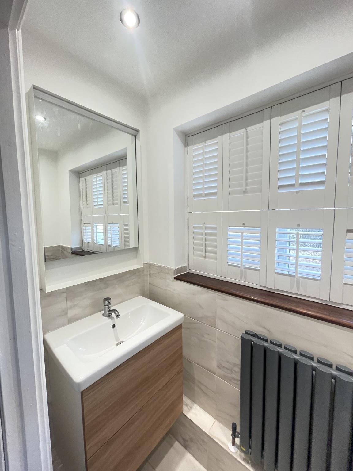 Contemporary cloakroom — completed bathroom
