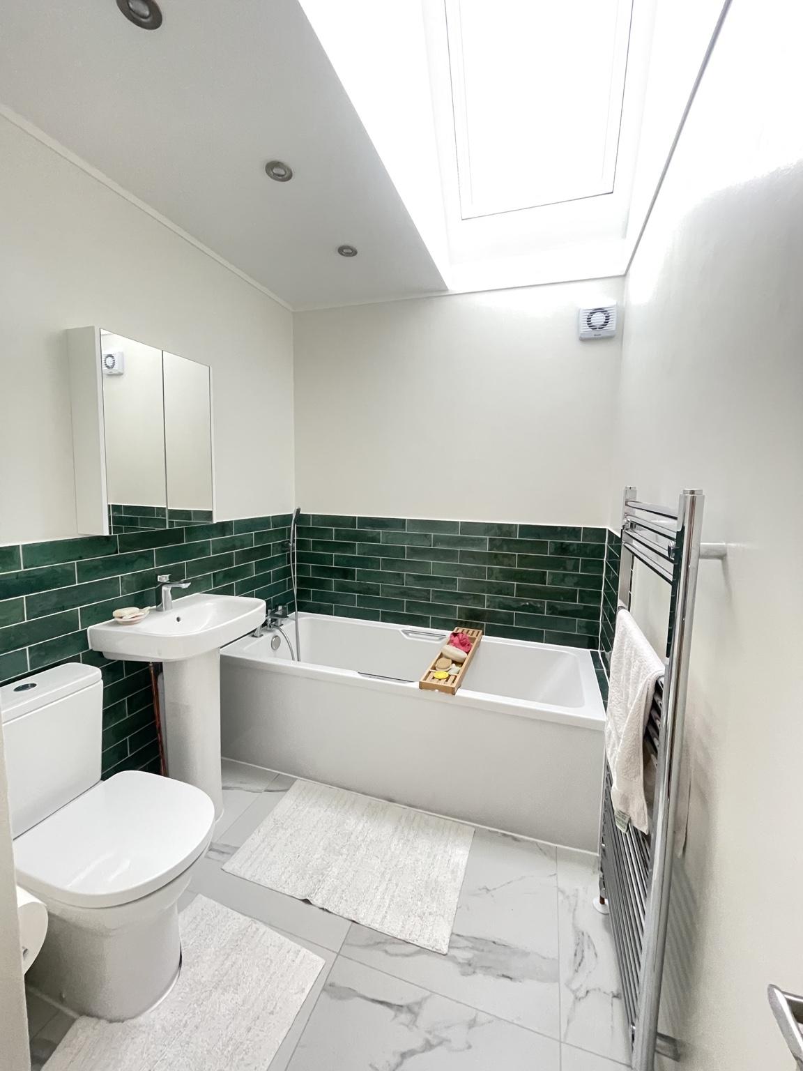 Emerald green family bathroom — completed bathroom