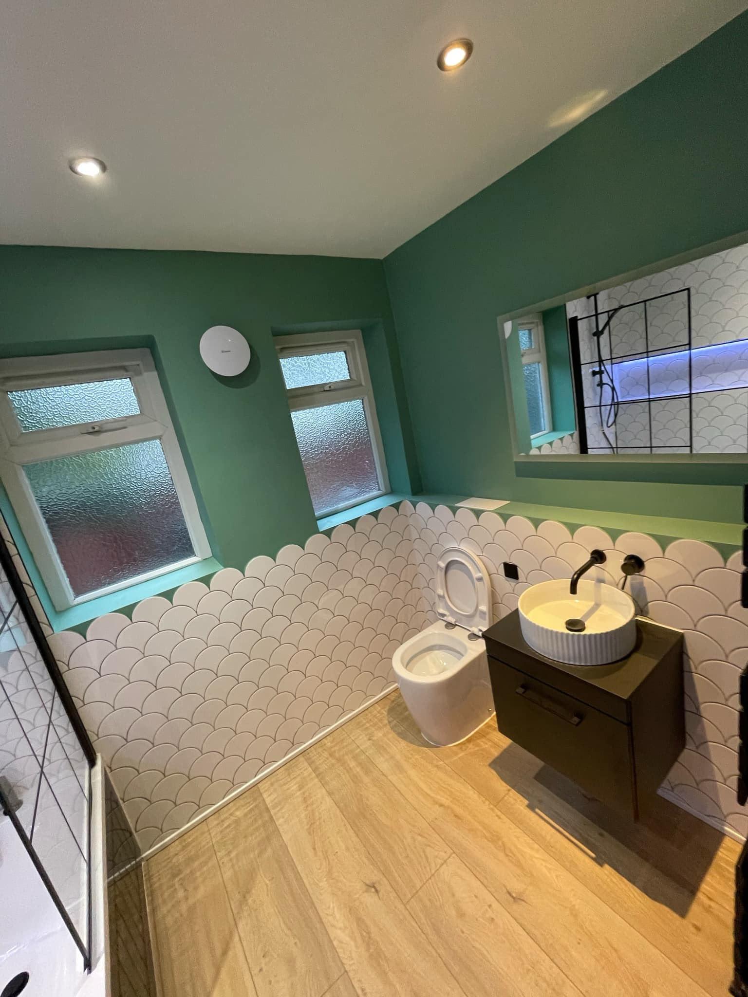 Green and white bathroom transformation — completed bathroom