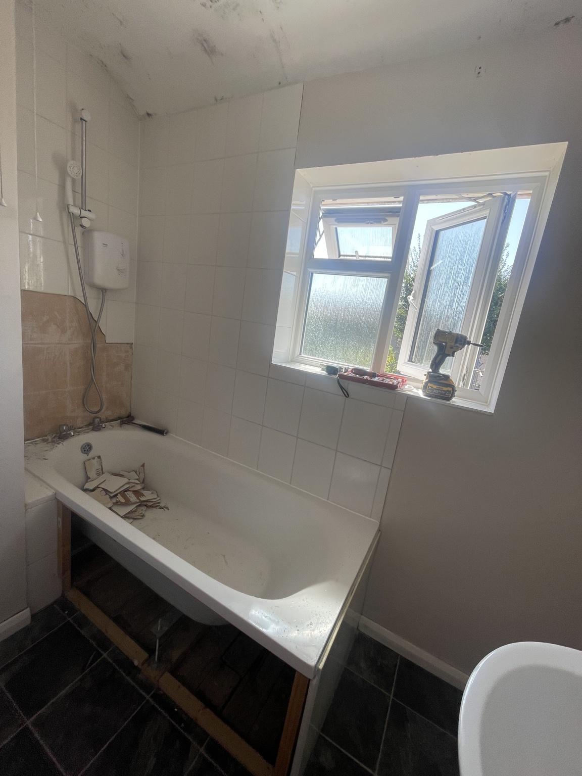 Bath and wall tiling during the renovation