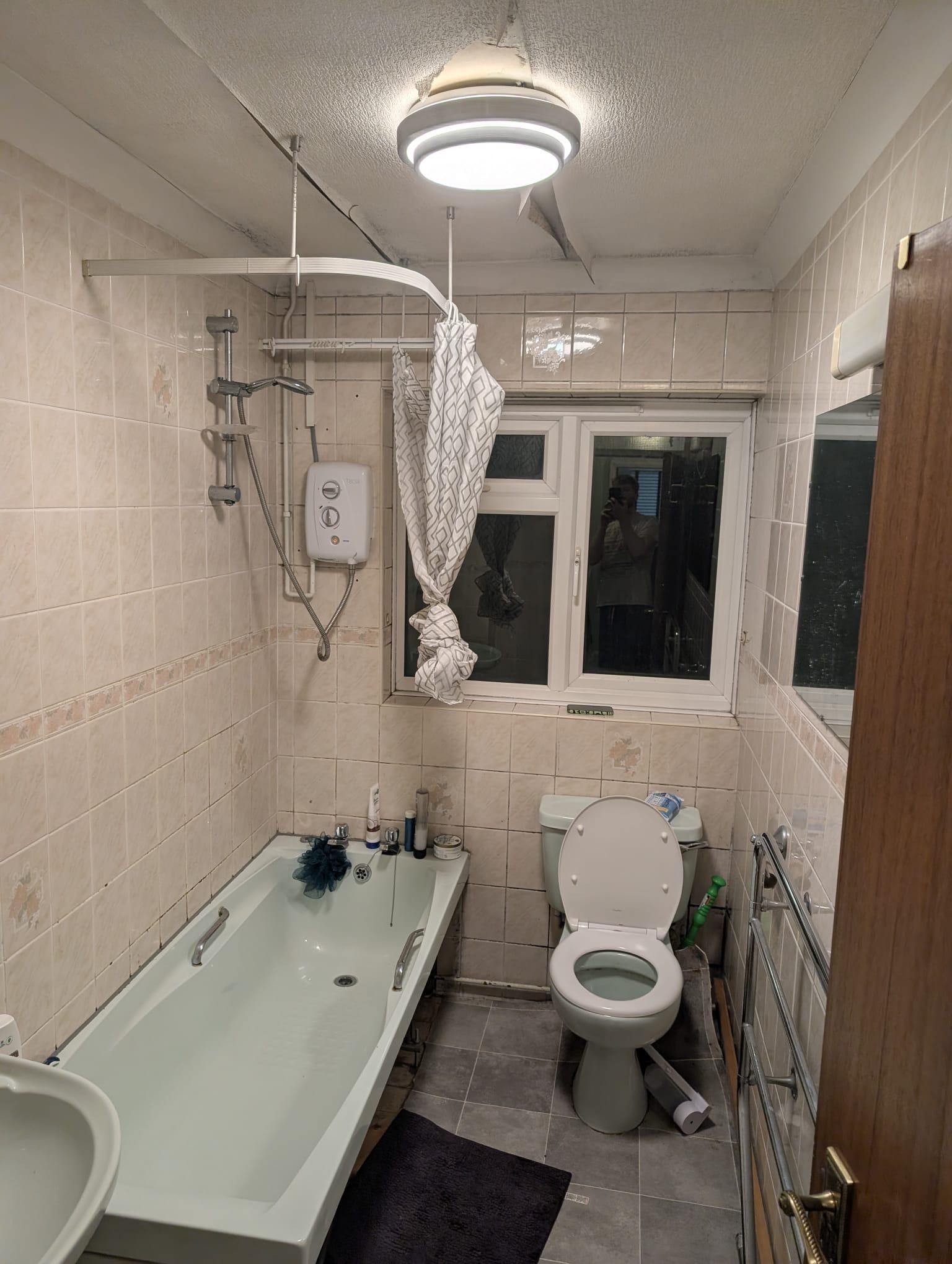 Original bathroom with bath and electric shower