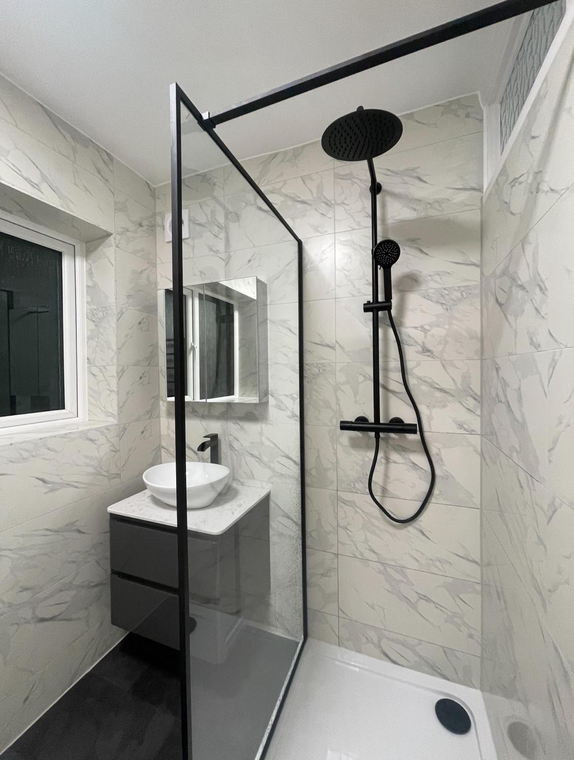 Completed black-framed shower room