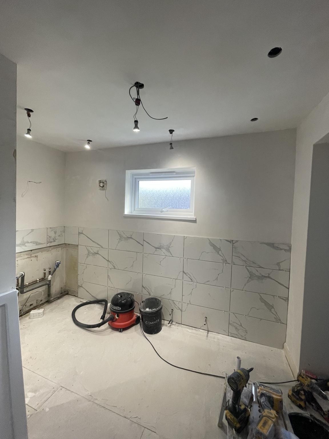 Wall tiling and plumbing after the wall removal