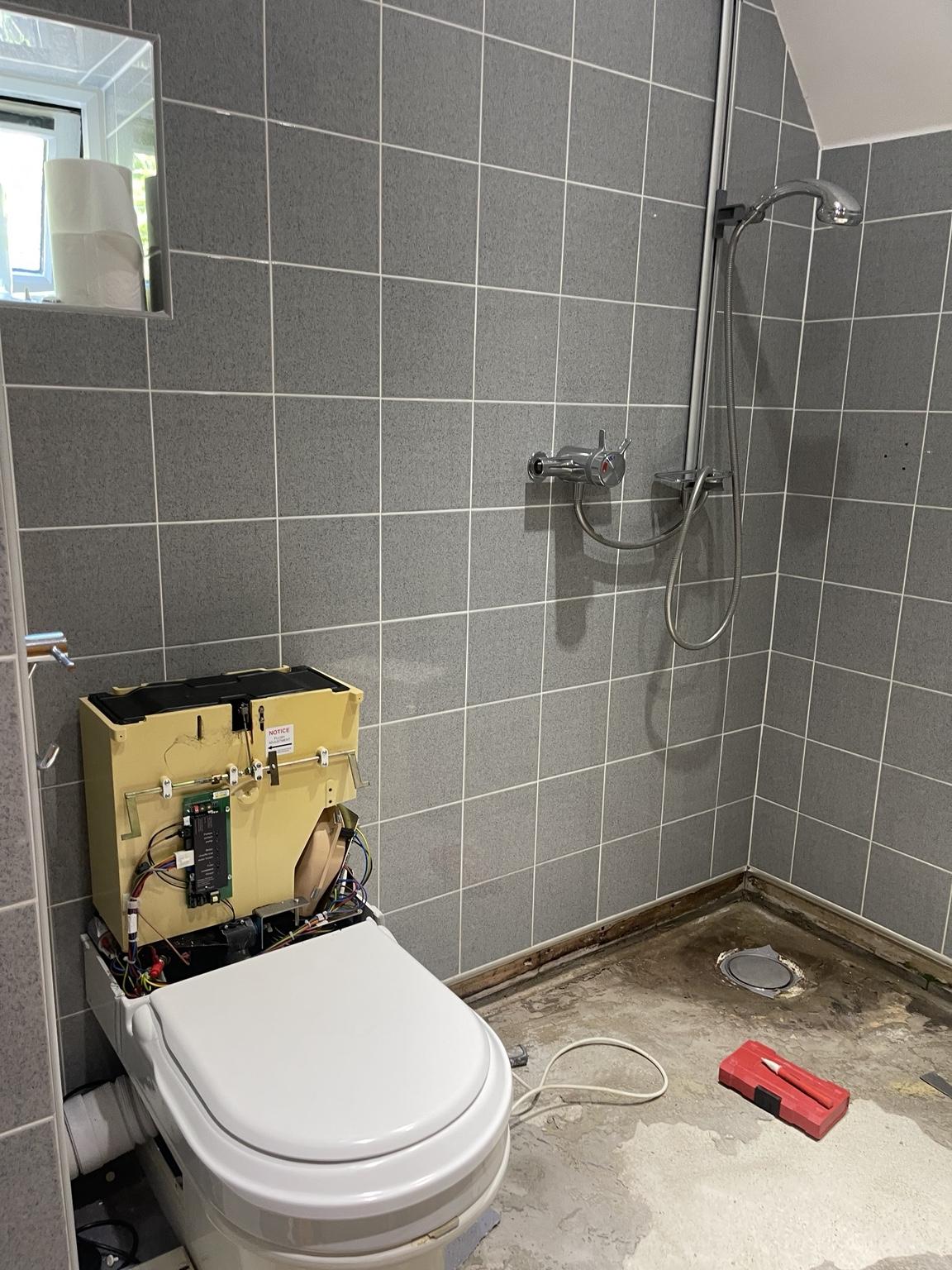 Seamless microcement wetroom during renovation, view 2