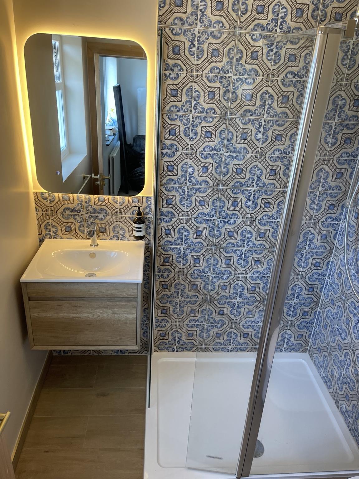 Completed vanity and walk-in shower